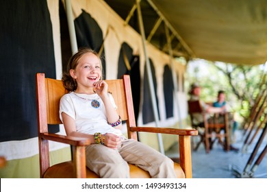 Family In Safari Tent Enjoying Vacation In Africa