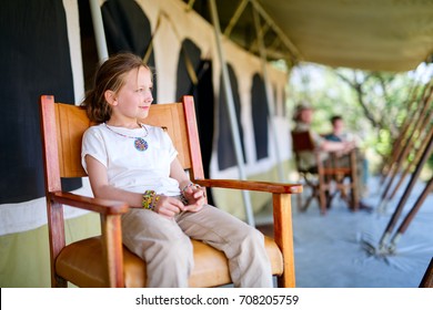 Family In Safari Tent Enjoying Vacation In Africa