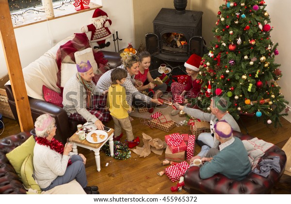 Family Sat Around Christmas Tree Opening Stock Photo 455965372 ...