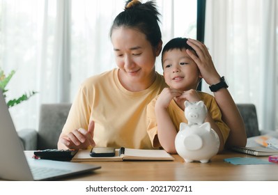 Family Saving Money Concept, Asian Woman And Son Note Family Expenditures For A Plan To Spend The Future In Earnest, Family And Financial Concept, Finance And Saving, Save Money.