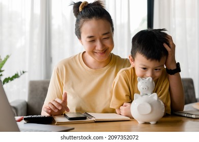 Family Saving Money Concept, Asian Woman And Son Note Family Expenditures For A Plan To Spend The Future In Earnest, Family And Financial Concept, Finance And Saving, Save Money. Family Budget Plan.