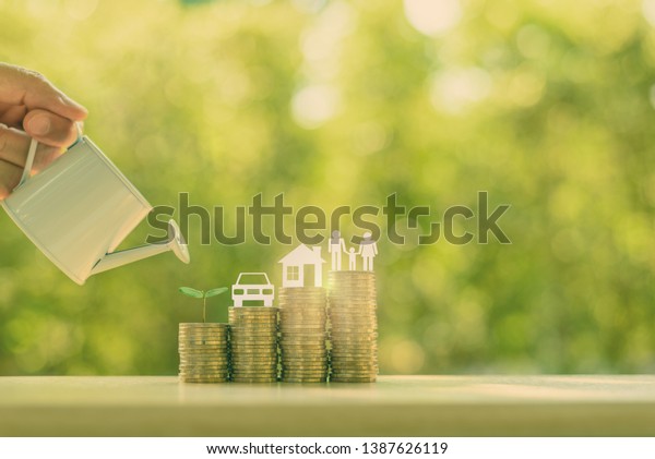 Family saving plan for basic needs concept : Water\
being poured on rows of rising coins with green sprout, car / auto\
model, a house or home, family members, depicts investing money for\
earning growth