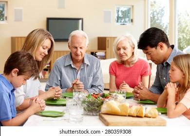 Family Saying Grace Before Meal