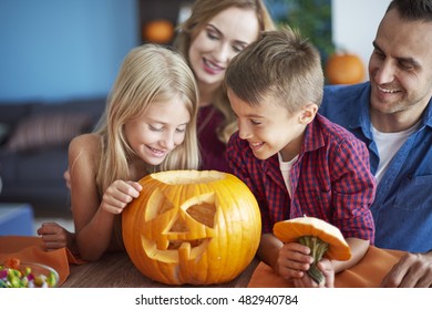 Family With Scary Halloween Pumpkin