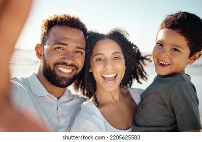 Family selfie portrait at beach holiday, summer vacation and relaxing sea together. Video call faces of excited, smile and happy mom, dad and boy kids photos for fun, happiness and sunny ocean travel - Shutterstock ID 2205625583
