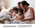 Family, selfie and tablet on bed for playful, relax and live streaming together with video and app. Parents, silly and children as people in home bedroom for film, social media and memory on weekend