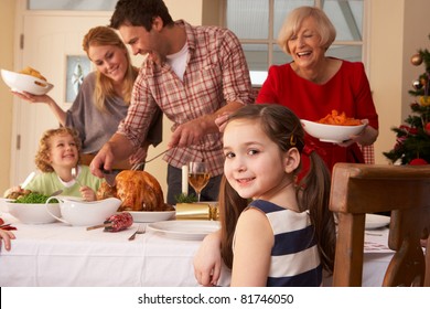 Family Serving Christmas Dinner