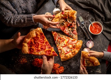 A Family Sharing Pizza Dinner 