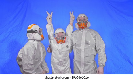 The Family Shield Protect, To Save Life From Virus. Slow Motion. People Portrait, Wearing Protect Medical Aerosol Spray Paint Mask Respirator. Concept Health Safety Protection Coronavirus Epidemic.