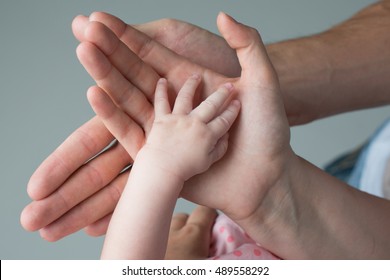 Family Shooting Hands Baby And Parents.