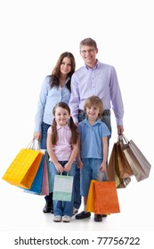 Family With Shopping Bags On A White Background