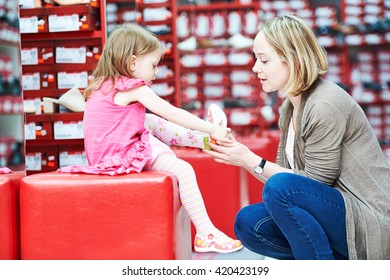 Family Shopping Choosing Child Footwear Shoes