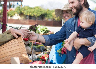 Family shopping at farmer's market - Powered by Shutterstock