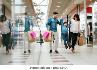 Family Shopping. Happy People In Mall