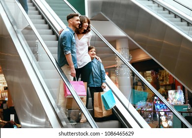 Family Shopping. Happy People In Mall