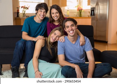 Family siblings at home smiling for a portrait love each other gathering reunion