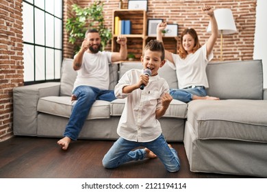 Family Singing Song Using Microphone At Home