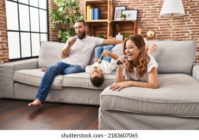 Family Singing Song Using Microphone At Home