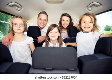 Family Sitting Inside Their Car