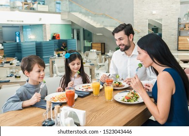 Family Sitting Together in the Restaurant Lunch Concept