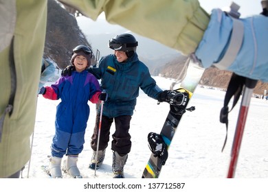 Family Skiing In Ski Resort