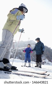 Family Skiing In Ski Resort