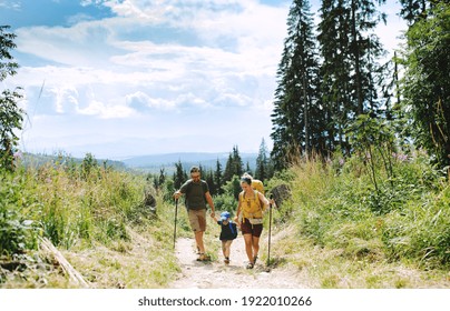 Family With Small Son Hiking Outdoors In Summer Nature.