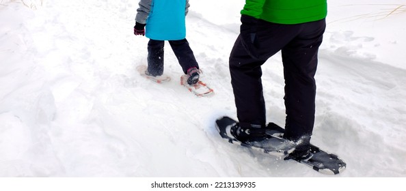 Family Snowshoeing In The Winter Snow Outdoors Kids Having Fun