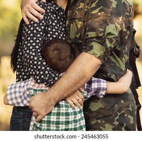 Family And Soldier In A Military Uniform Say Goodbye Before A Separation