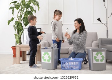 Family Sorting Garbage At Home. Concept Of Recycling