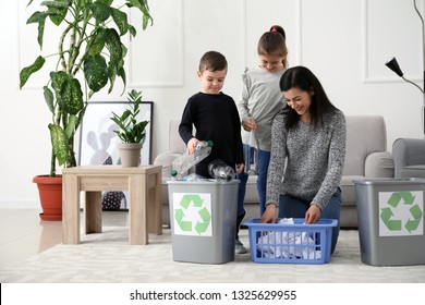 Family Sorting Garbage At Home. Concept Of Recycling