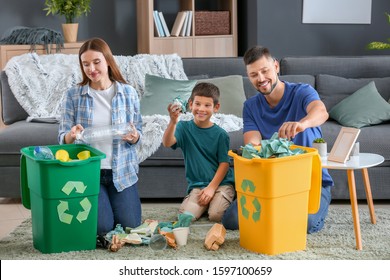 Family Sorting Garbage At Home. Concept Of Recycling