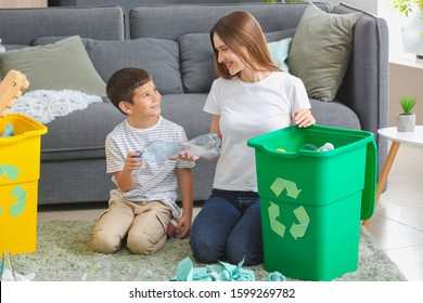 Family Sorting Garbage At Home. Concept Of Recycling