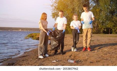 Family Sorting Garbage Near The Coast. Concept Of Recycling