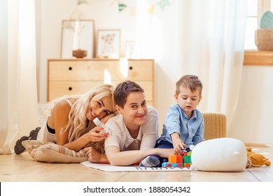 Family Spending Time Together. Lesbian Moms With Their Foster Son