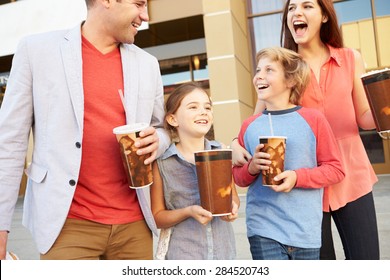 Family Standing Outside Cinema Together