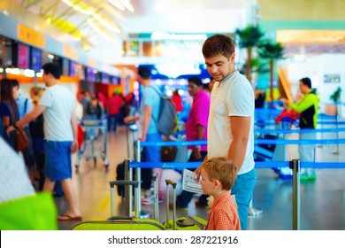 Family Standing In Queue At Passport Control Check In International Airport