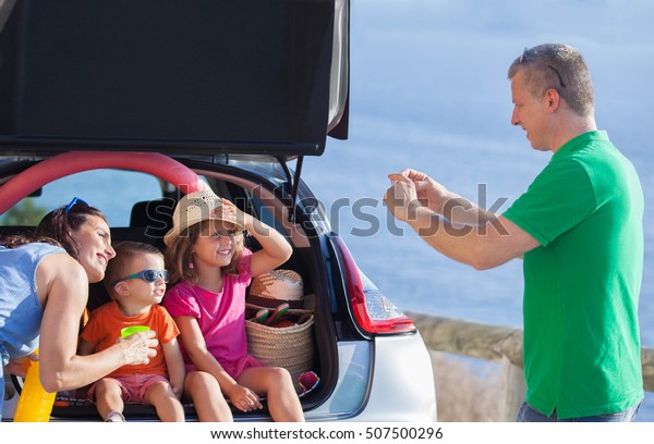 family summer holiday
sitting in car. 