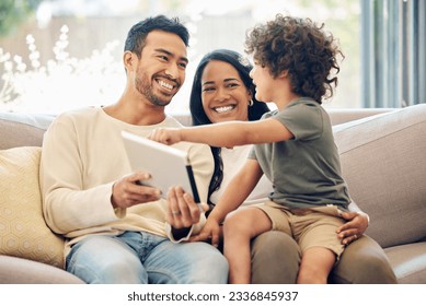 Family, tablet and child learning on a home sofa with happiness, development and internet connection. Man, woman and son or kid together on a couch with technology for education, games and online app - Powered by Shutterstock