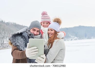 Family Takes A Selfie In Their Winter Holiday Trip