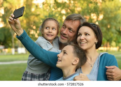 Family taking selfie in park