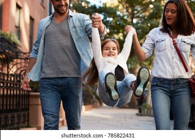 Family taking a walk down the street, close up
