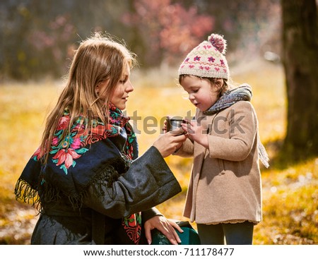 family Tea in autumn park