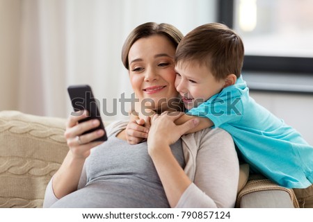 Similar – Image, Stock Photo Pregnant woman and little daughter in the rustic kitchen