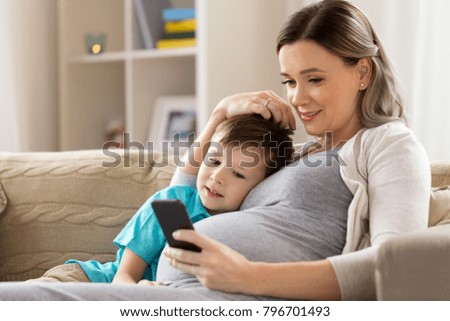 Image, Stock Photo Pregnant woman and little daughter in the rustic kitchen