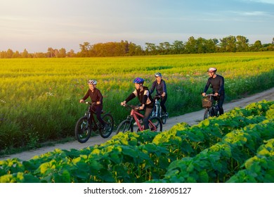 Family With Teenage Children On Cycle Ride In Countryside. Sports family riding bicycles. Father, mother daughter and son with bikes - Powered by Shutterstock