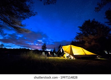 Family Tent With Rigid Steel Poles On Camping Ground Under Starry Sky With Milky Way