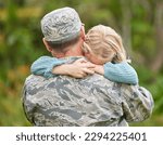 Family is there to support you and honor your decisions. Shot of a father returning from the army hugging his daughter outside.