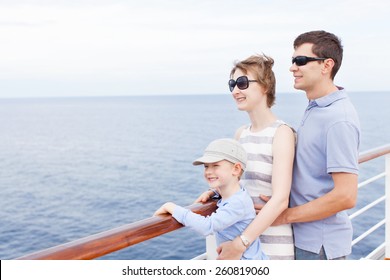 Family Of Three Enjoying Vacation At Cruise Ship