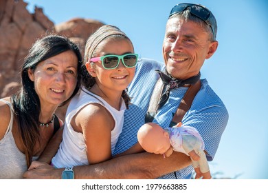 Family Of Three People Happy Visiting US National Park In Summertime.